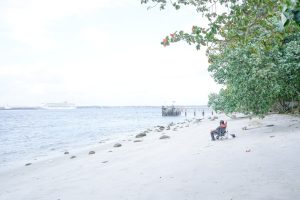 image of a man enjoying the beach view