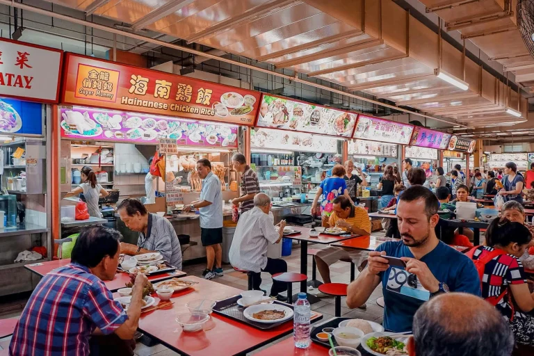 Tourists trying local delicacies at a food market